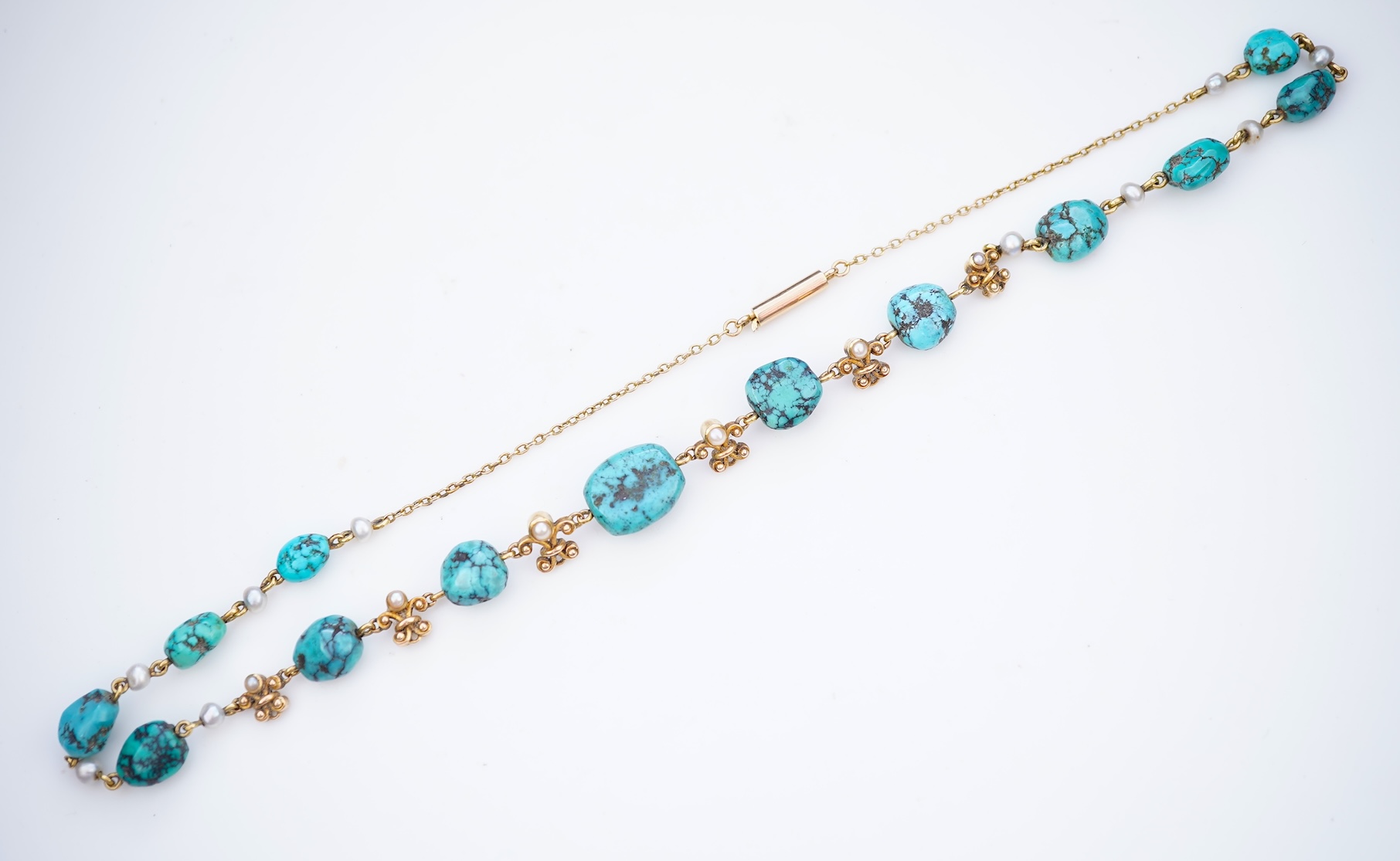 A turquoise and seed pearl necklace, early 20th century
